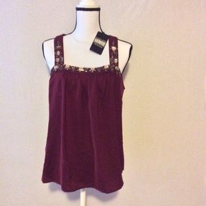 Burgundy sleeveless blouse with decorated neckline